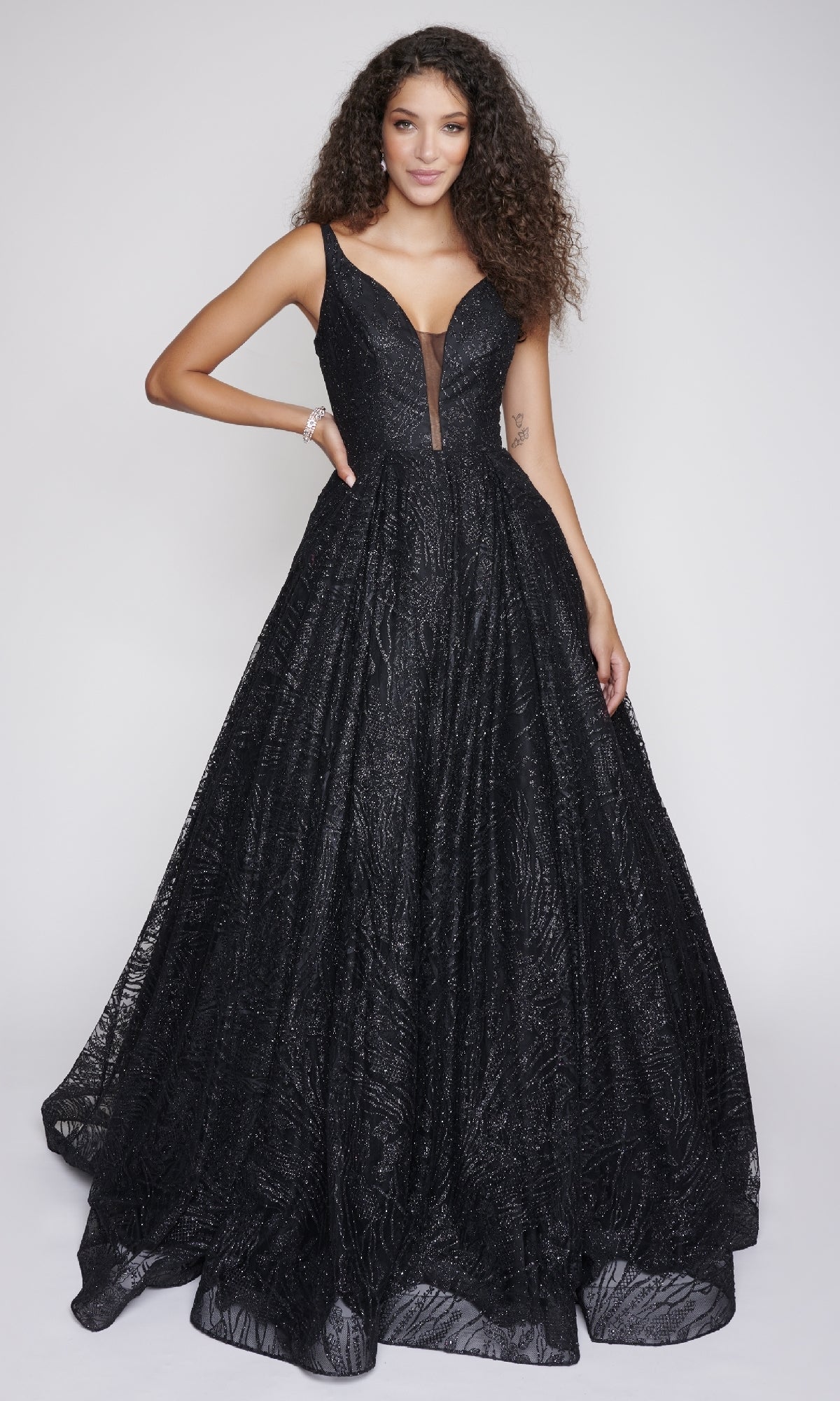 Woman wearing a black evening gown on a white background